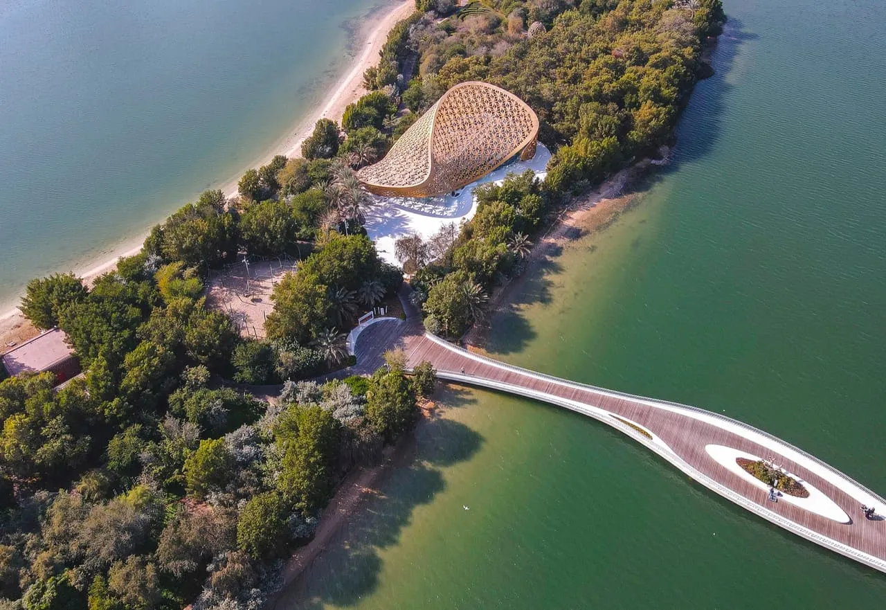 Al Noor Island from the air, with the Butterfly House among the trees and the footbridge over the lagoon