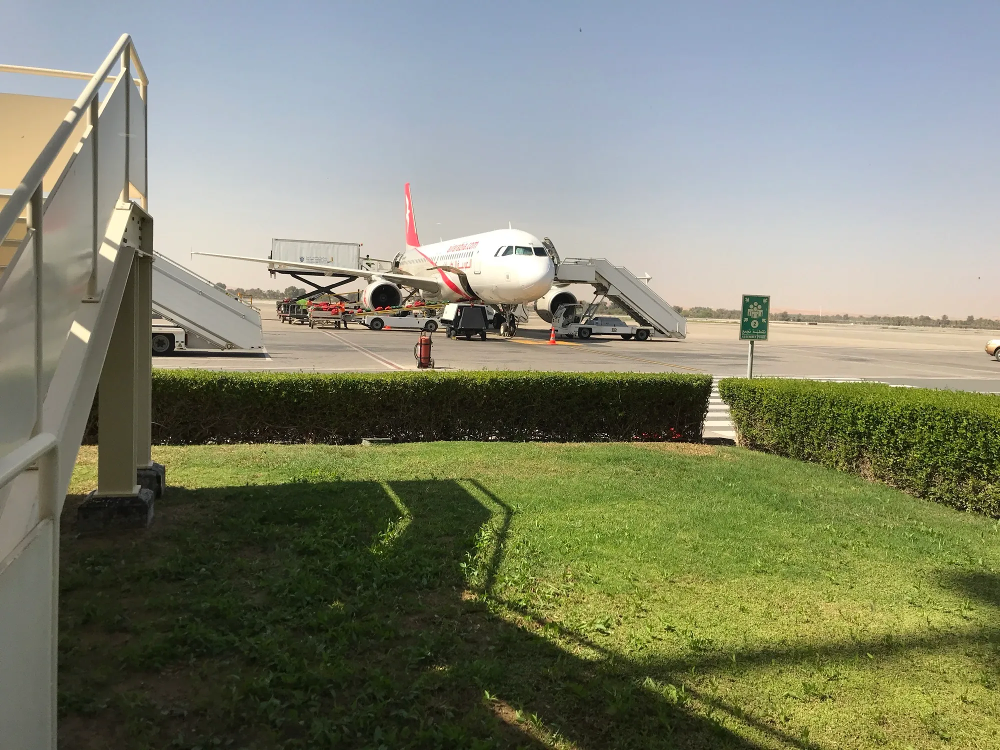 An Air Arabia Airbus A320 being unloaded on the apron at Ras Al Khaimah International Airport