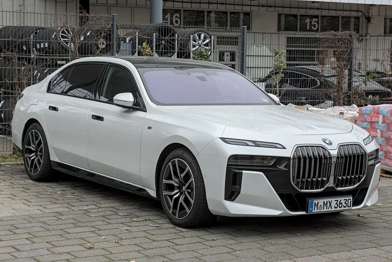 A white BMW 7 Series sedan of the current generation, seen from the front
