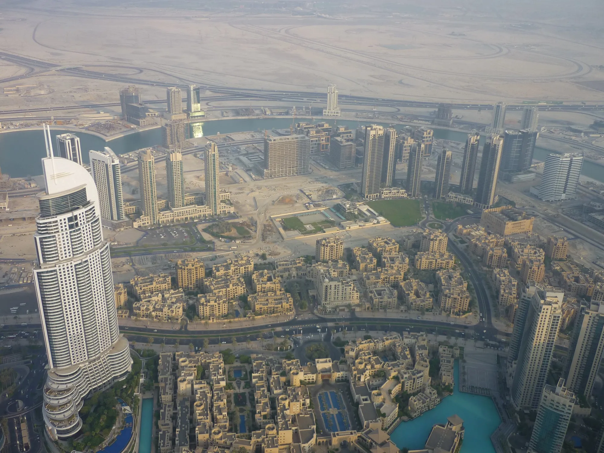 Looking down from the Burj Khalifa at The Address Downtown, the Old Town buildings and the lake in Downtown Dubai