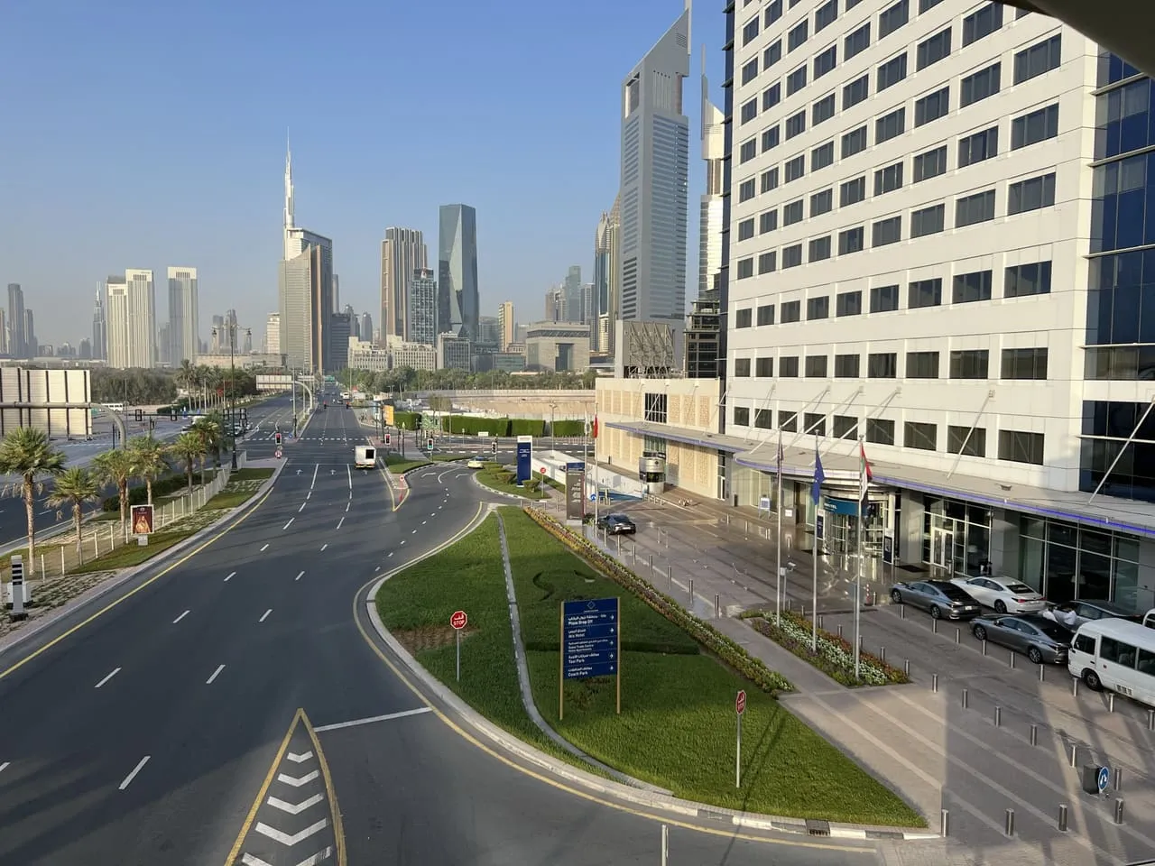 The road into the Dubai World Trade Centre complex, with Burj Khalifa and the Sheikh Zayed Road towers behind
