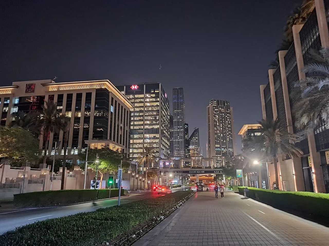Office towers lit up at night around Emaar Square in Downtown Dubai