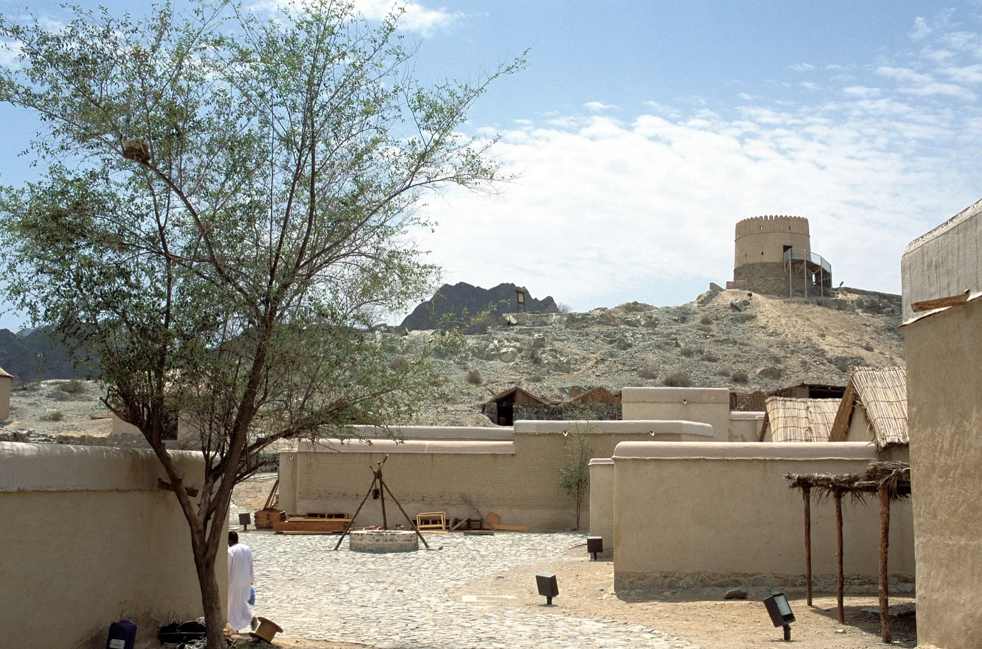 Mud-brick walls and a watchtower at Hatta Heritage Village