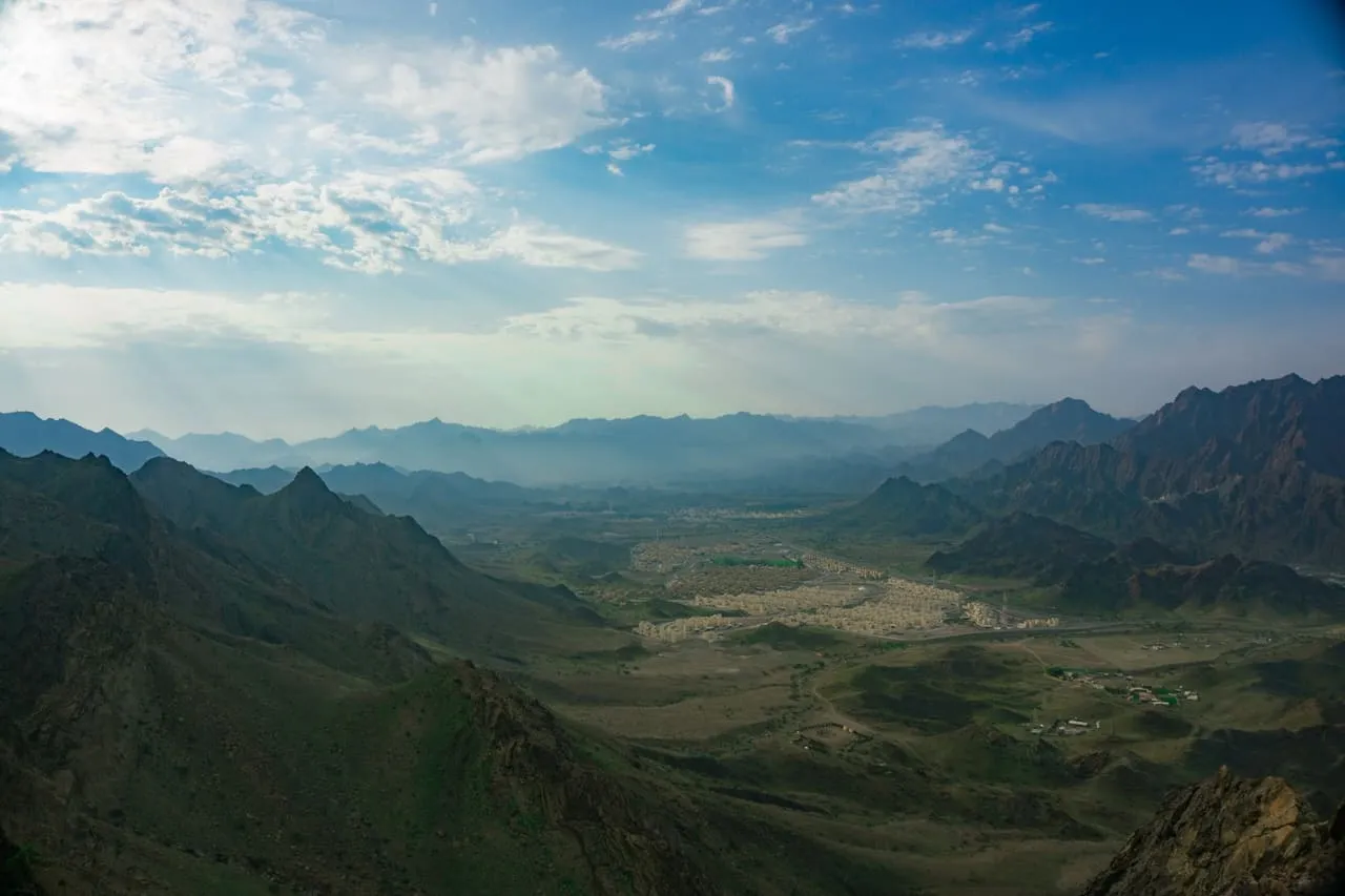 Hatta town in its valley, ringed by the Hajar Mountains, seen from a ridge above