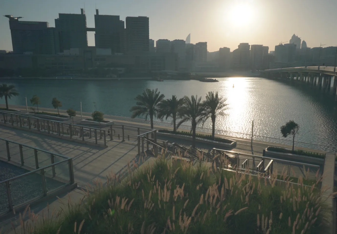 The Abu Dhabi skyline at sunset seen from Al Maryah Island, with the Tourist Club area across the water