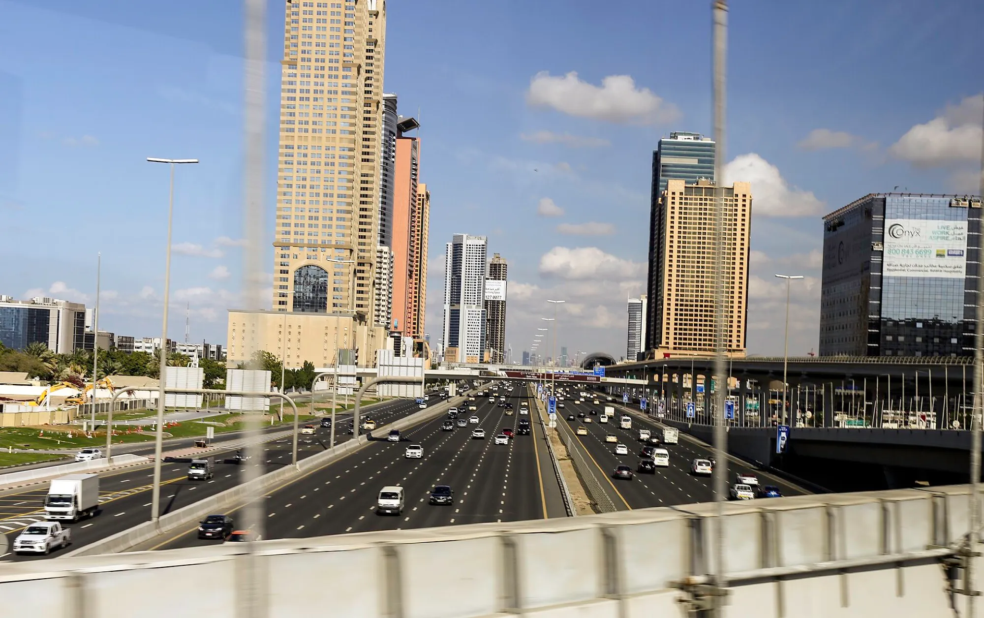 The E11 Sheikh Zayed Road in Dubai, a wide multi-lane highway between high-rise towers
