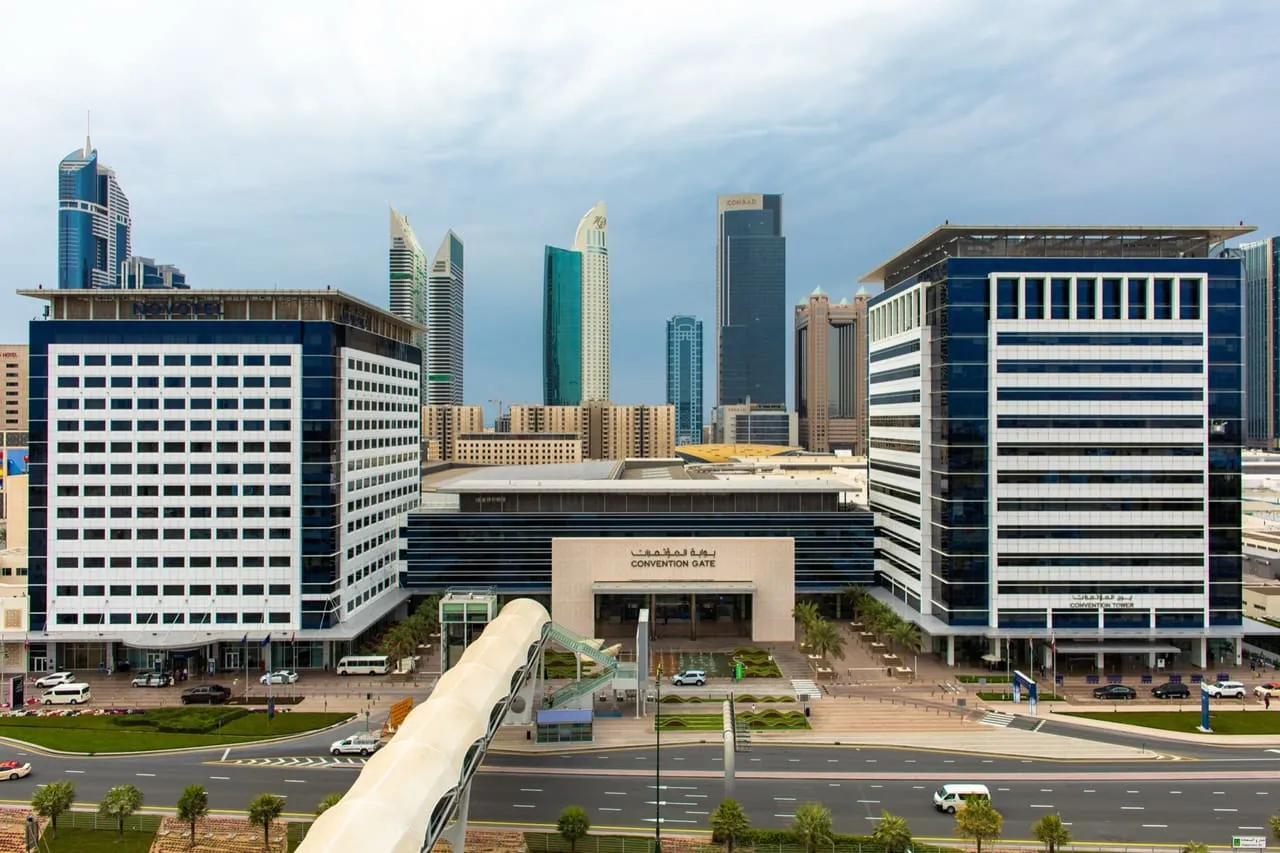 Convention Gate at Dubai World Trade Centre, between the Novotel and Convention Tower, with the Sheikh Zayed Road towers behind