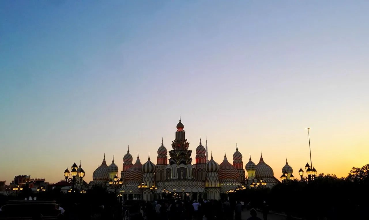 The Global Village entrance in Dubai at dusk
