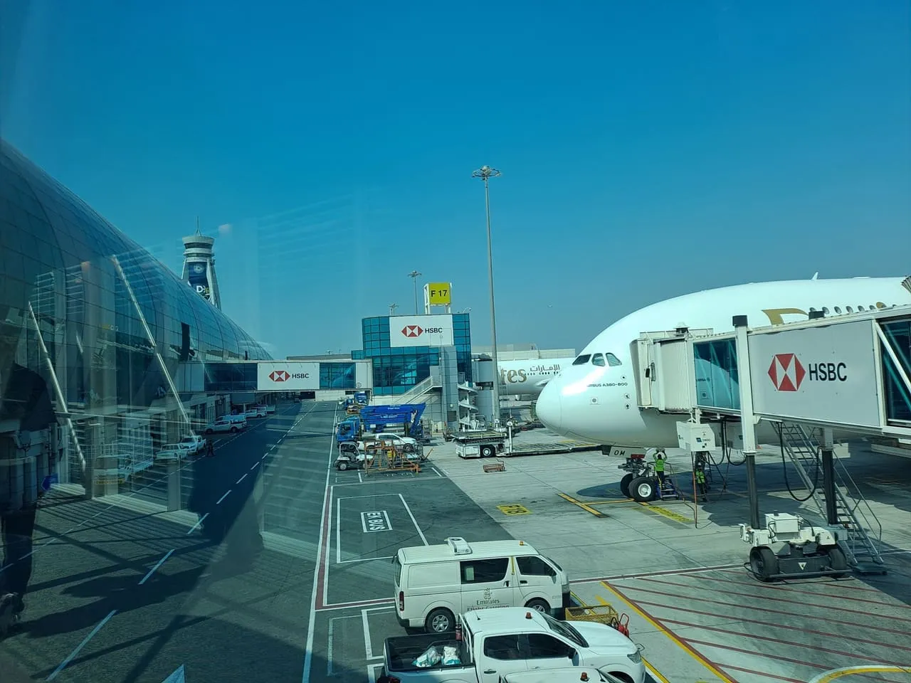 An Emirates Airbus A380 parked at an air bridge at Dubai International Airport