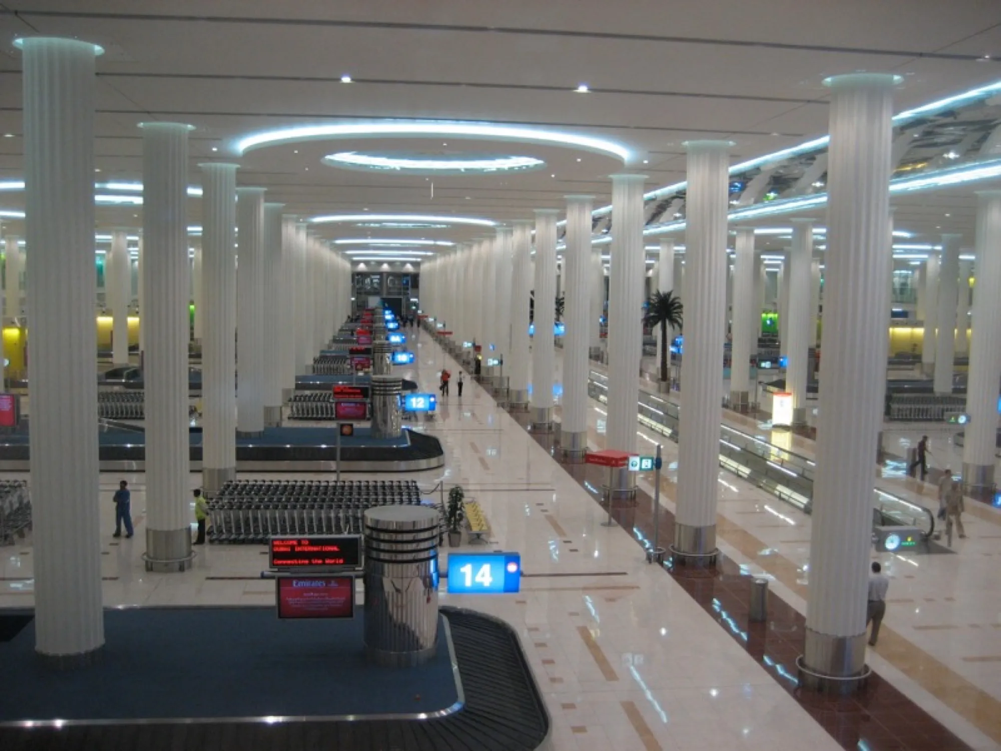 Baggage reclaim hall at Dubai International Terminal 3, with carousels and rows of white columns