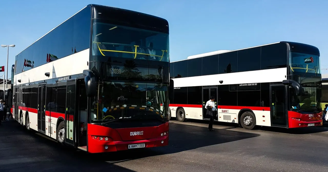 Two Dubai RTA double-decker buses parked at Al Jubail bus station in Sharjah