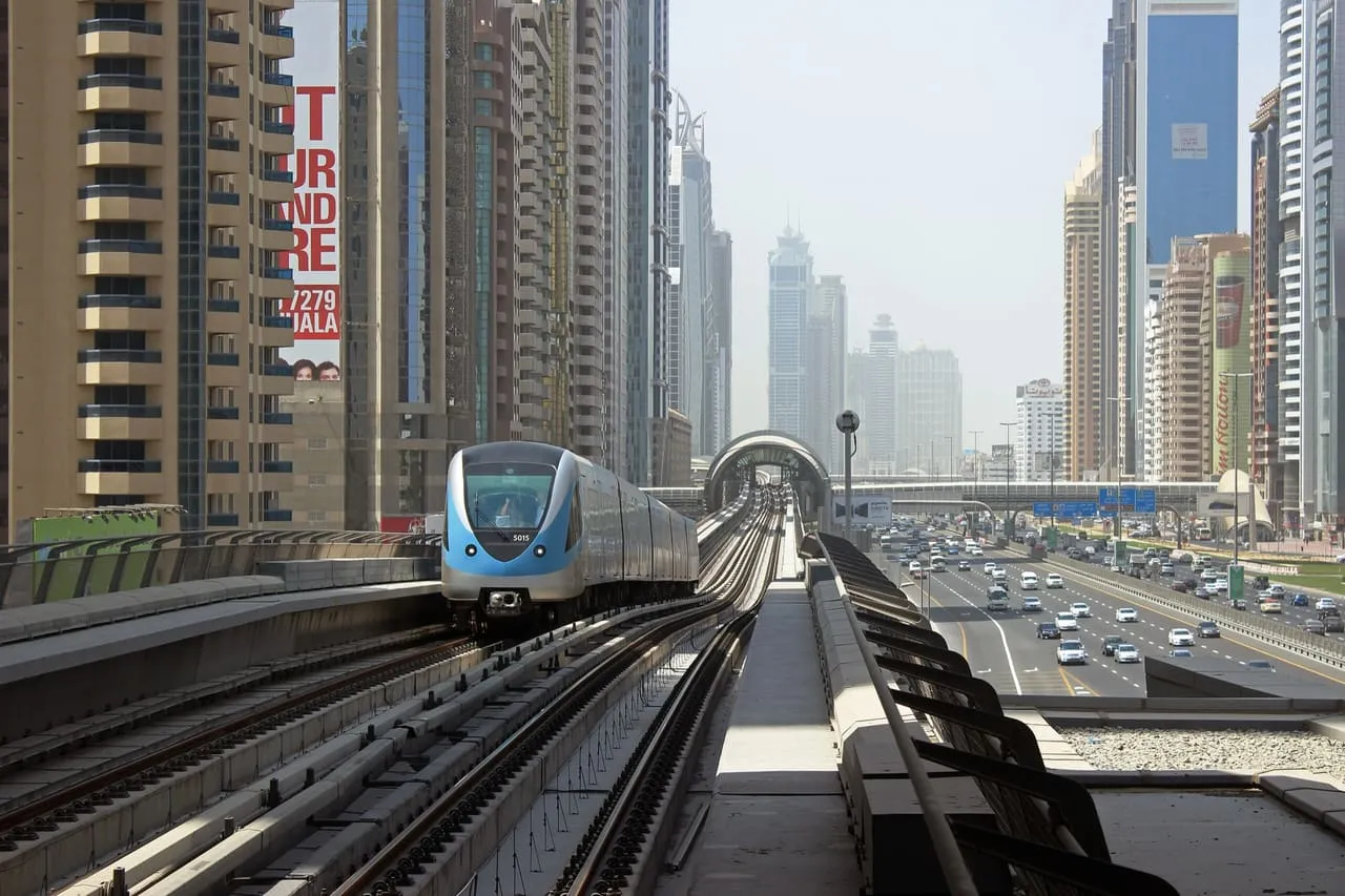 A Dubai Metro Red Line train on the raised track beside Sheikh Zayed Road