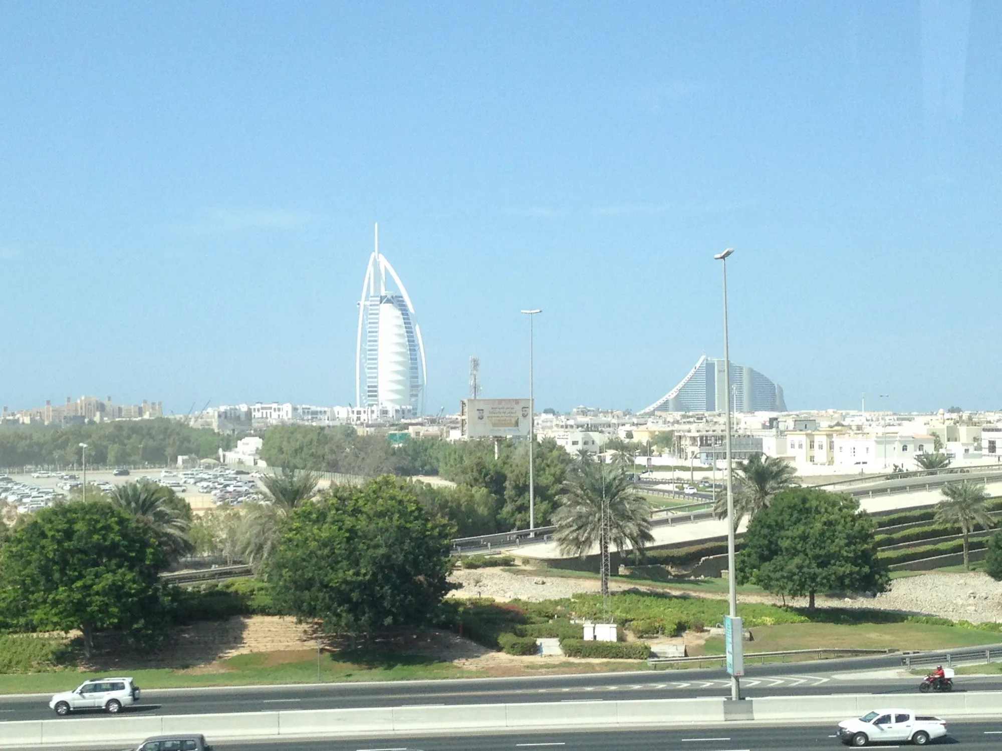 The Burj Al Arab and Jumeirah Beach Hotel seen across the Umm Suqeim roads from the highway side