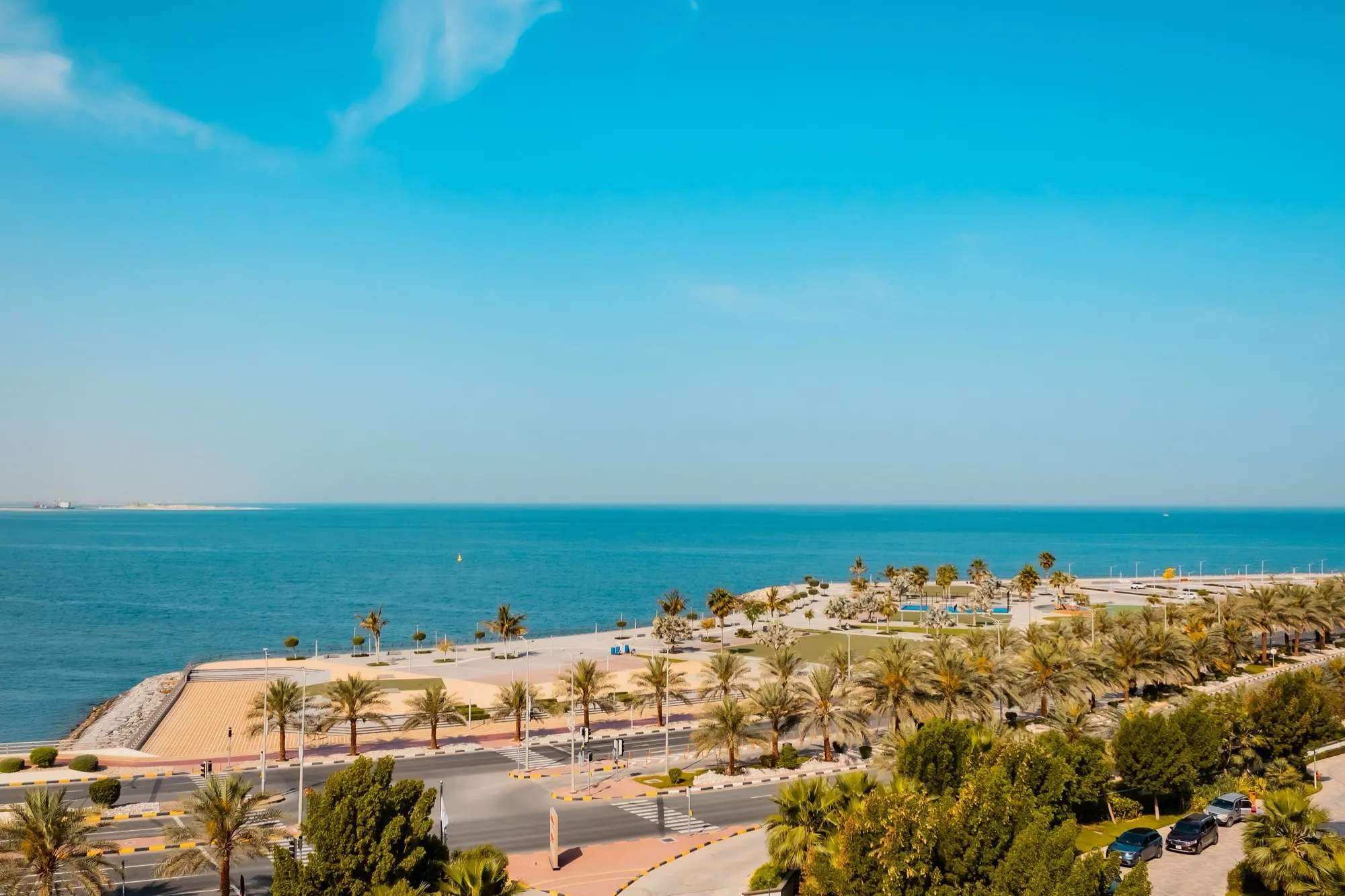 Palm-lined waterfront promenade and sea on Marjan Island, Ras Al Khaimah