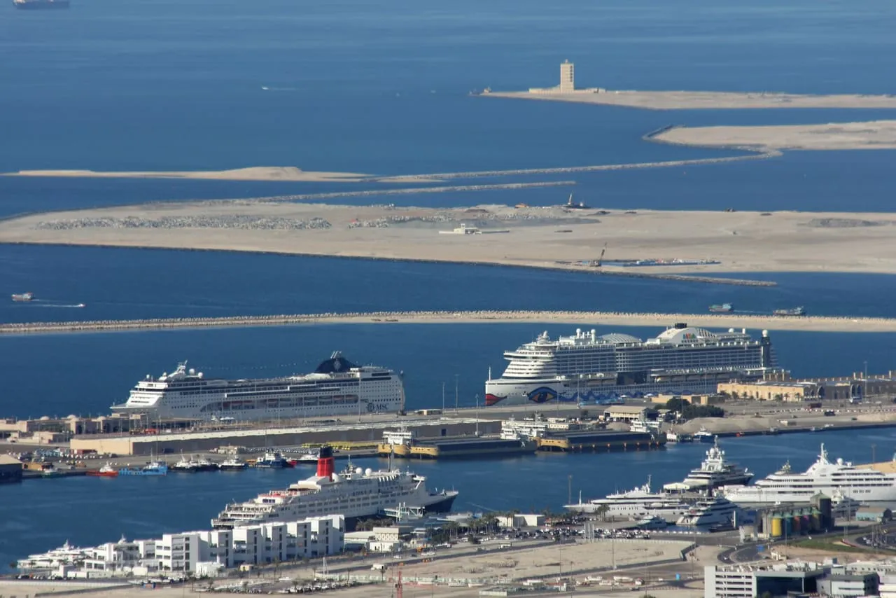 Two cruise ships berthed at Mina Rashid in Dubai, with the Queen Elizabeth 2 moored in the foreground, seen from the Burj Khalifa