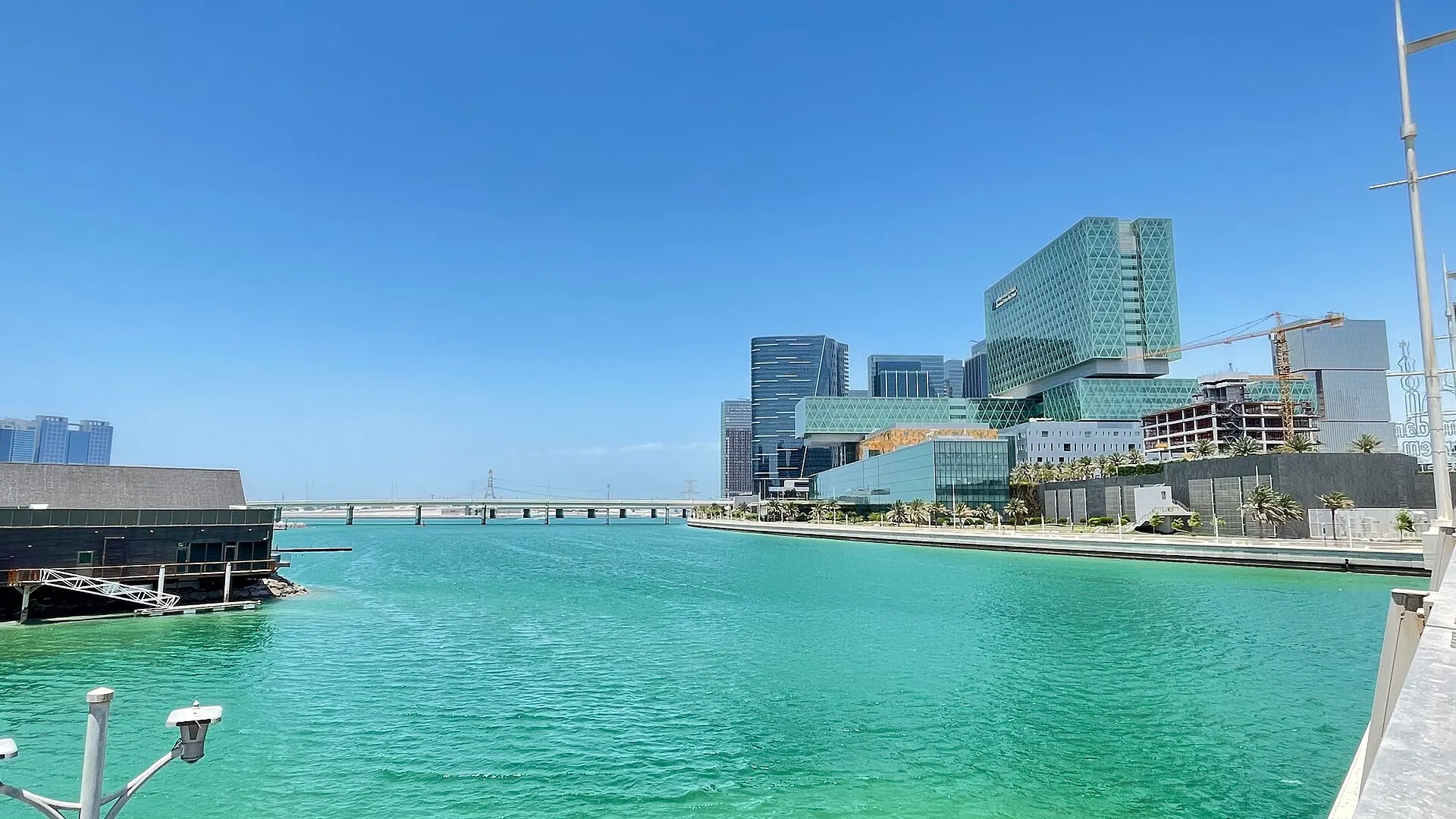 Business towers on Al Maryah Island seen across a channel of water in Abu Dhabi