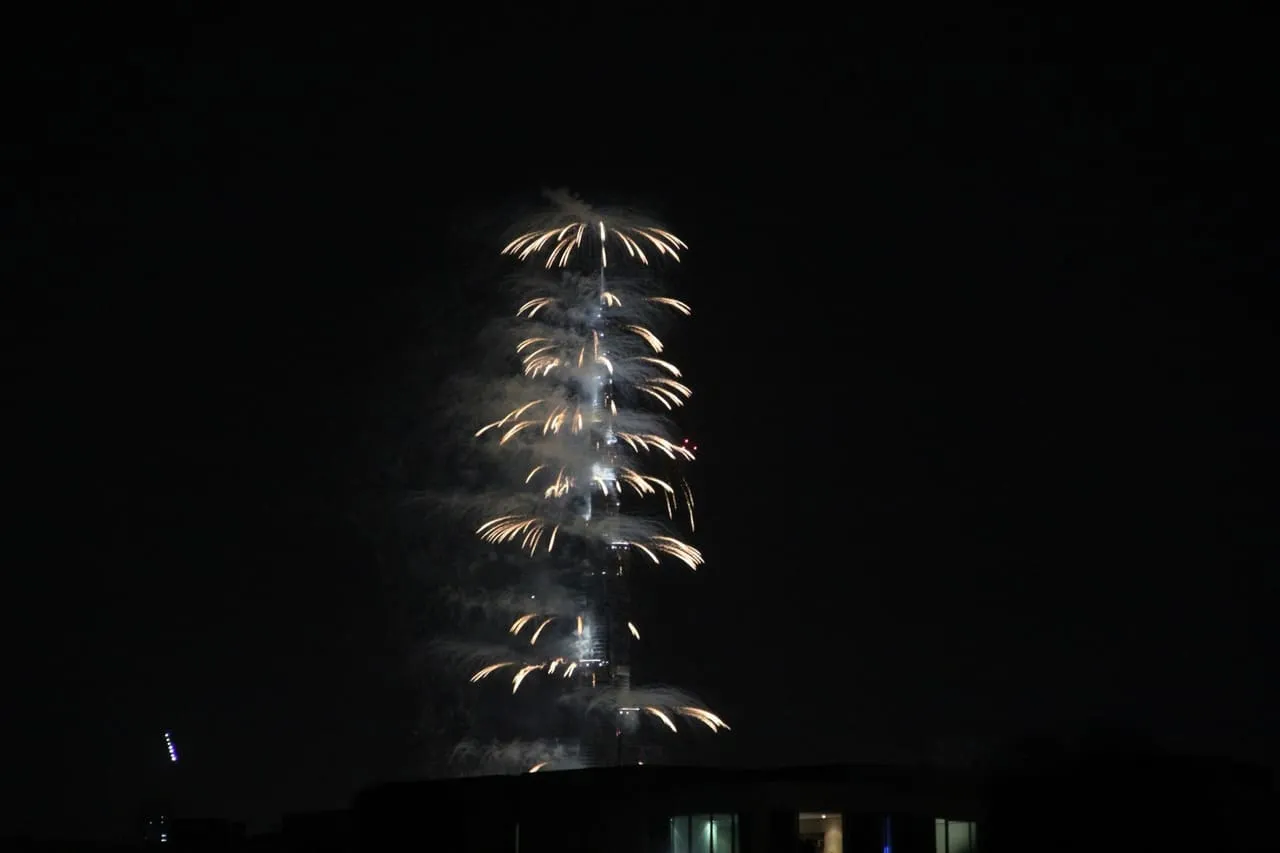Fireworks bursting down the length of Burj Khalifa at midnight on New Year's Eve in Downtown Dubai