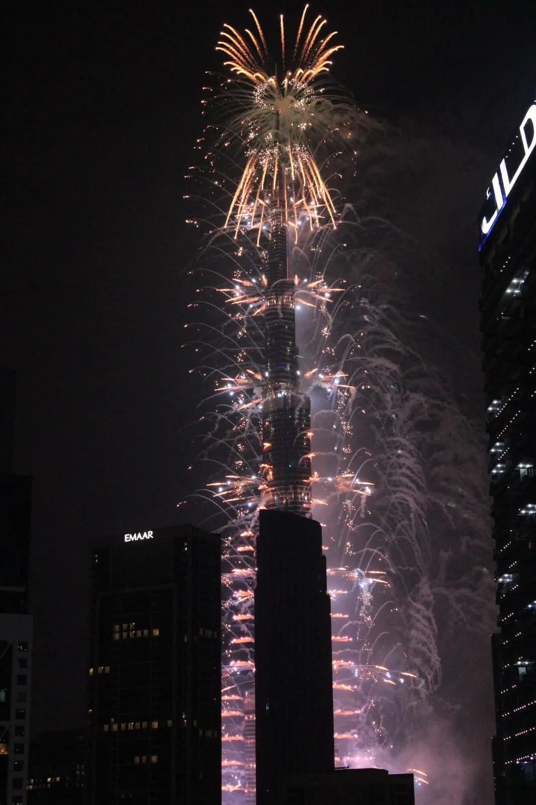 Fireworks running down the Burj Khalifa in Downtown Dubai at night