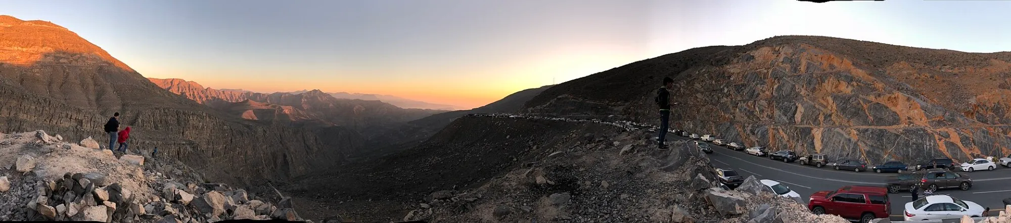 Panorama of the Jebel Jais mountain road and valley at sunset