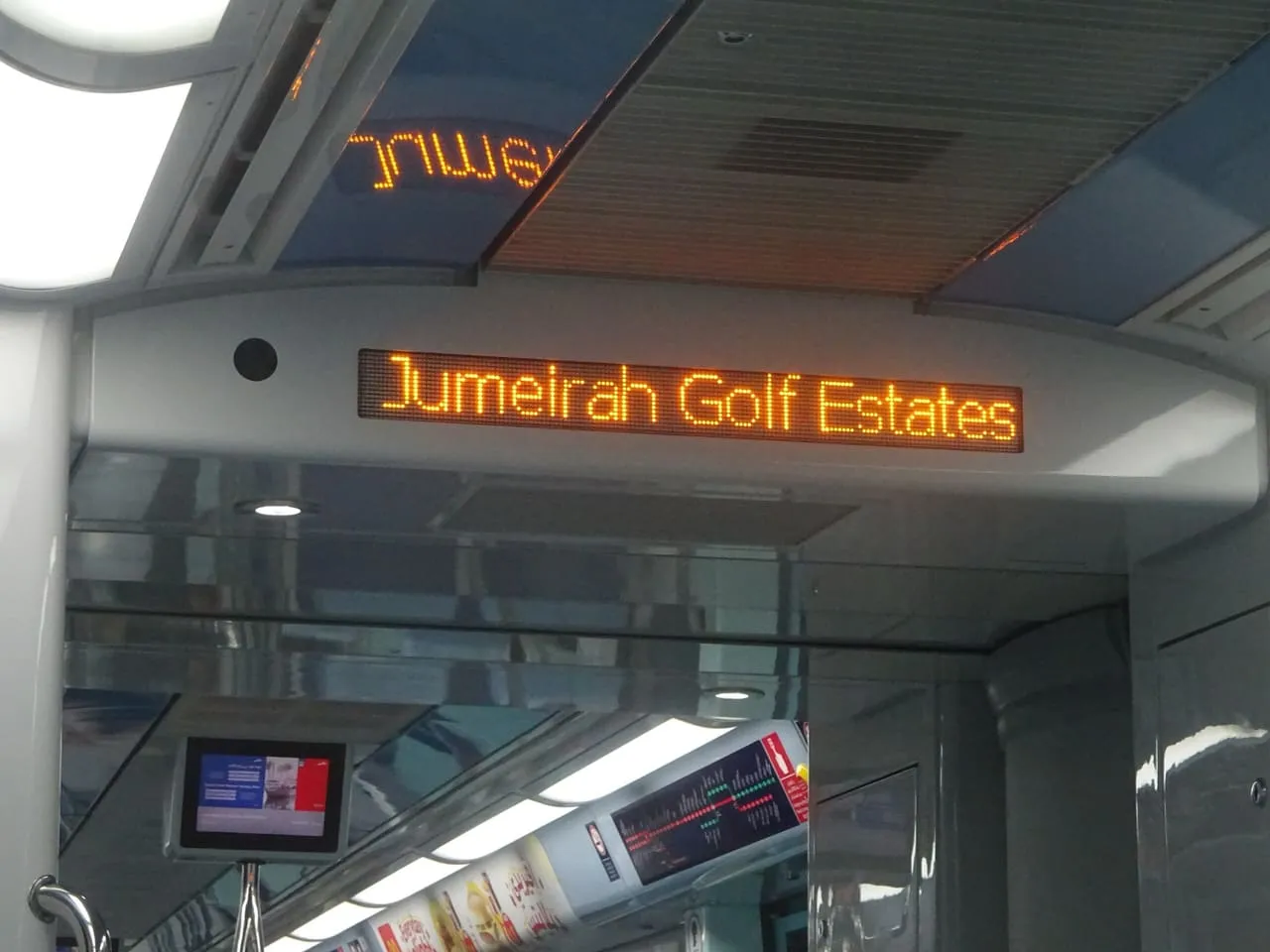 Jumeirah Golf Estates shown on the next-station display inside a Dubai Metro Red Line train