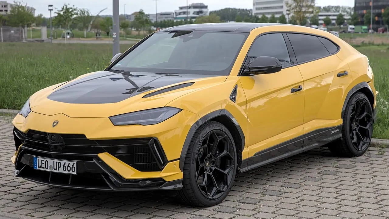 A yellow Lamborghini Urus Performante SUV, seen from the front