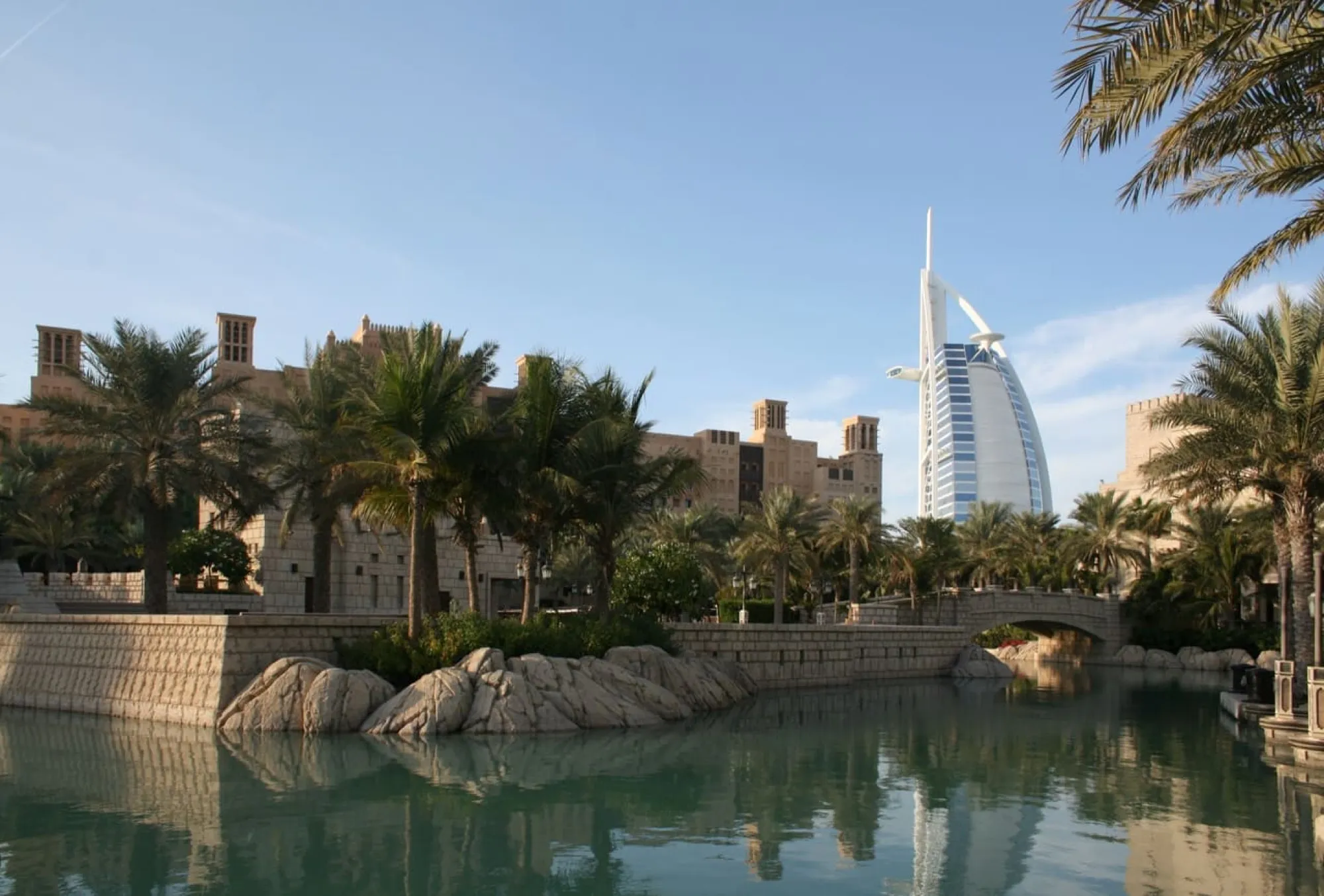 Madinat Jumeirah waterways with the Burj Al Arab behind the palms