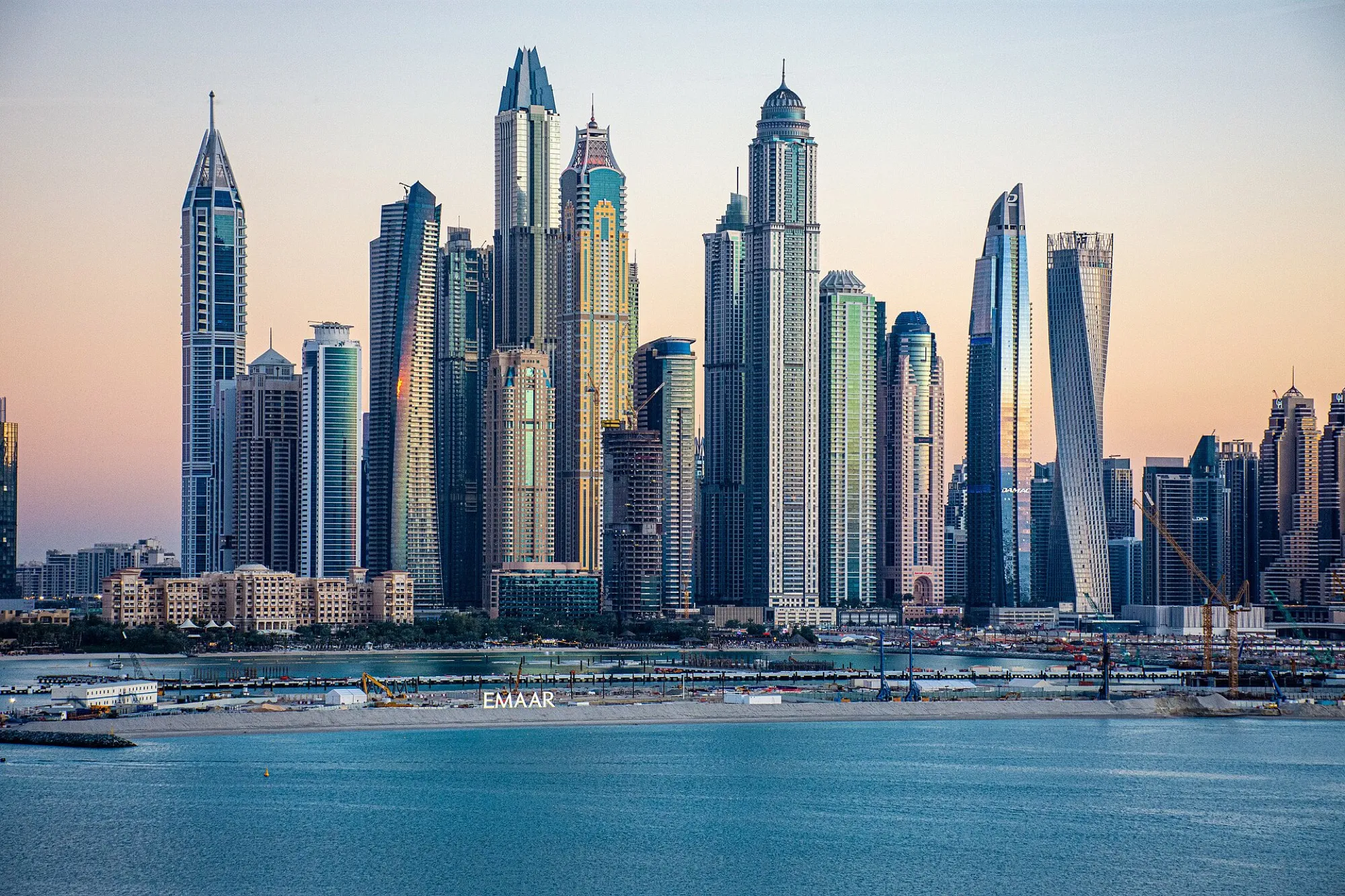 The towers of Dubai Marina at dusk, seen across the water from Palm Jumeirah