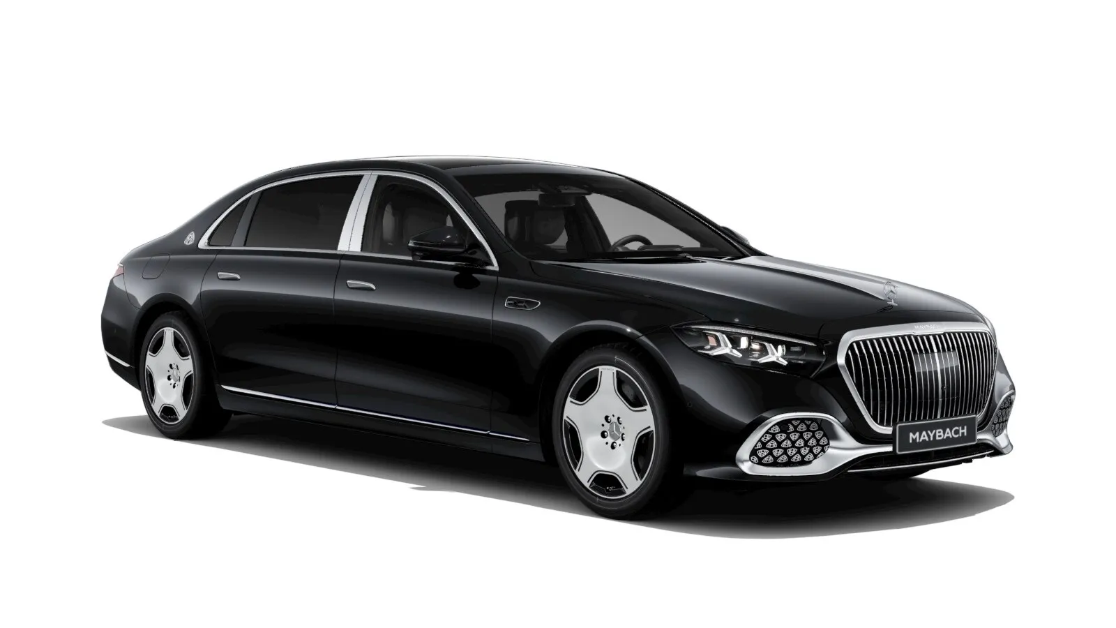 A black Mercedes-Maybach S-Class limousine on a white background, seen from the front right