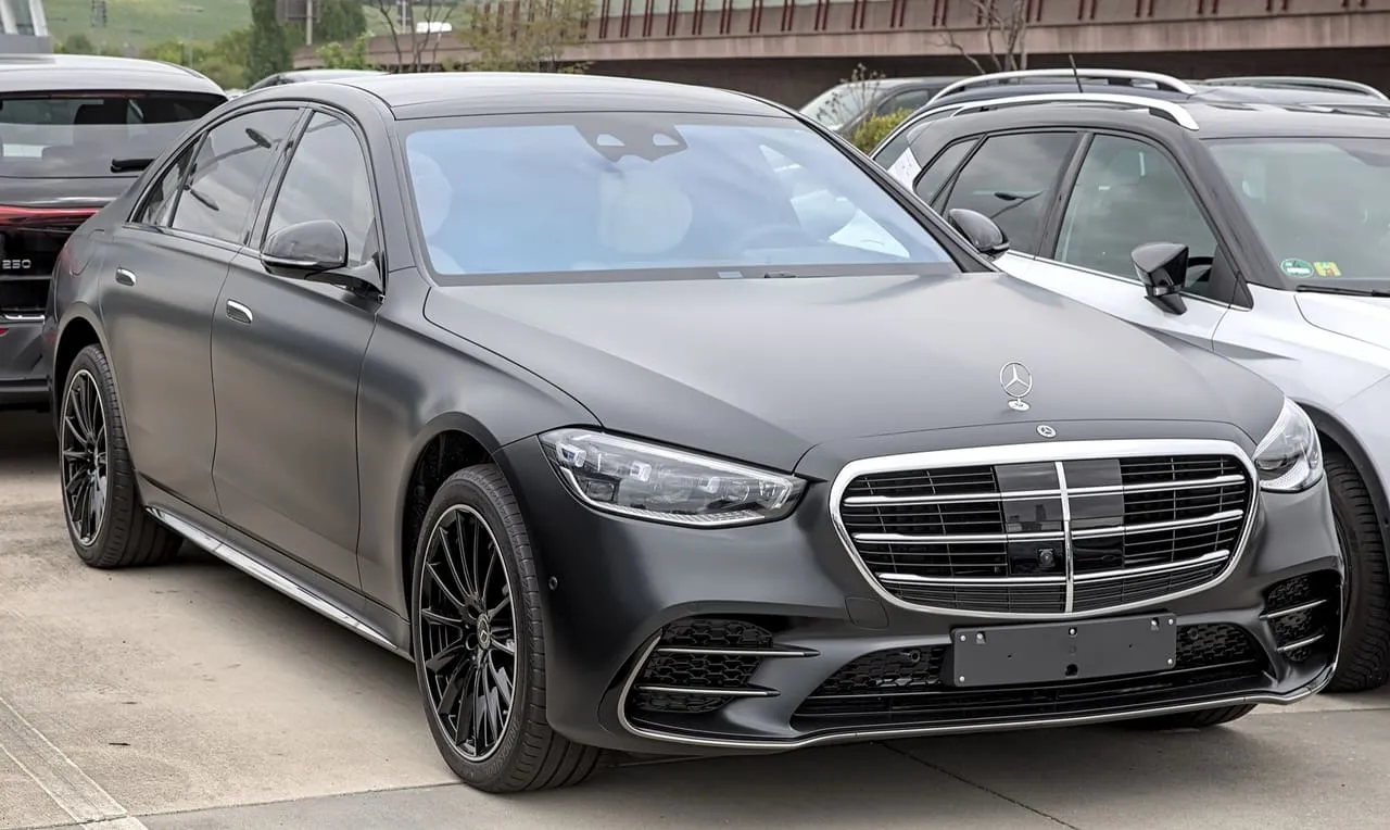 A matte black Mercedes-Benz S-Class S 580 4MATIC sedan, seen from the front