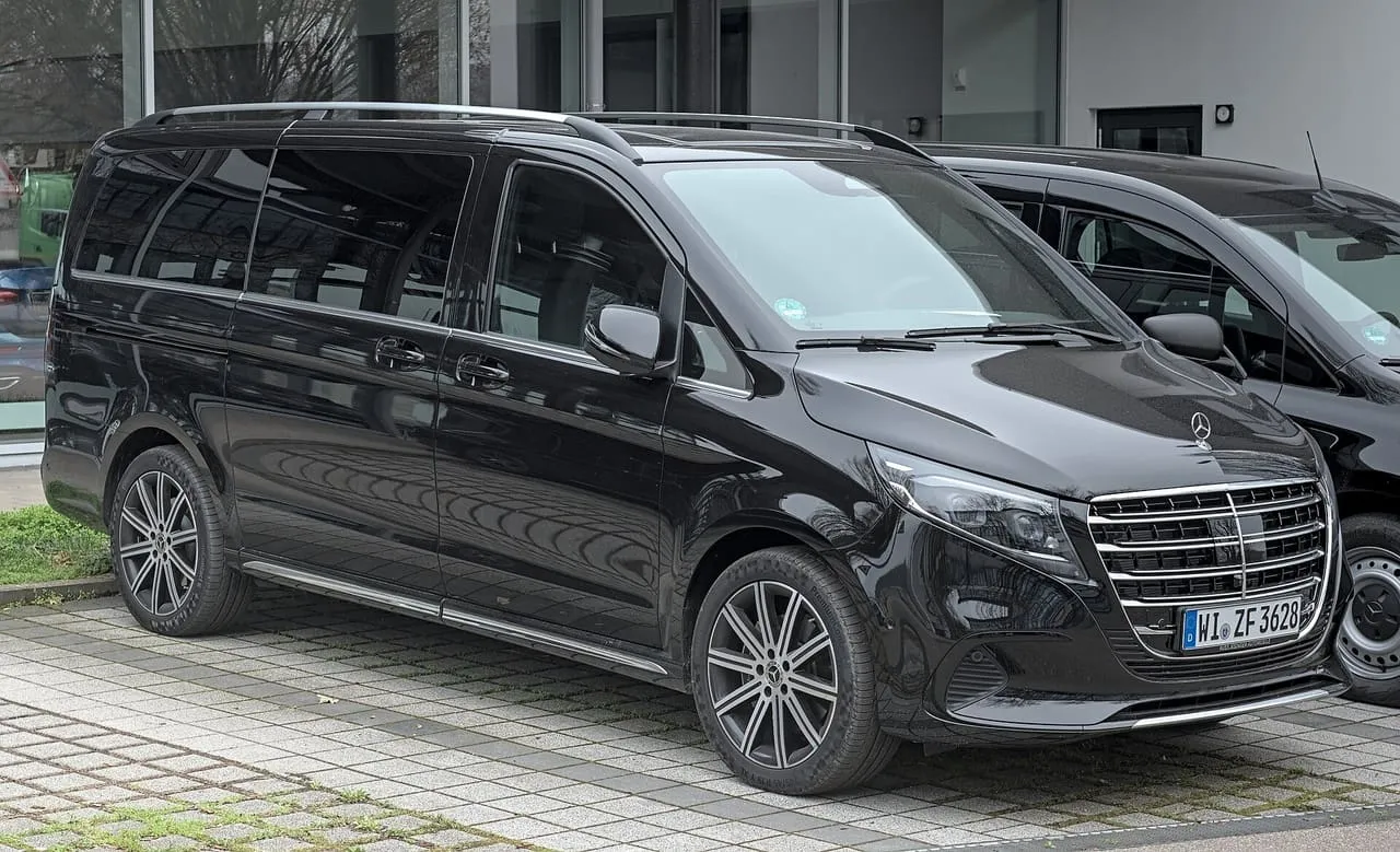 A black Mercedes-Benz V-Class people carrier, the 2023 model