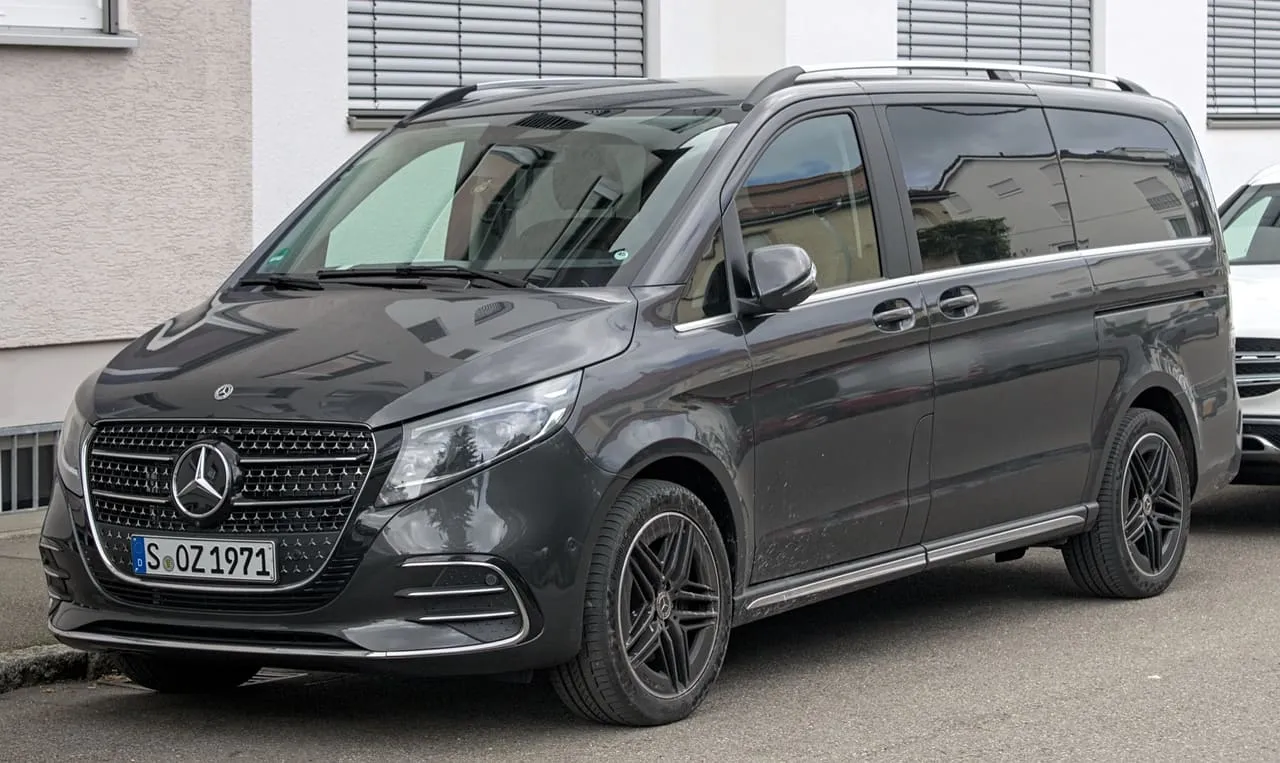 A dark grey Mercedes-Benz V-Class van parked at the kerb