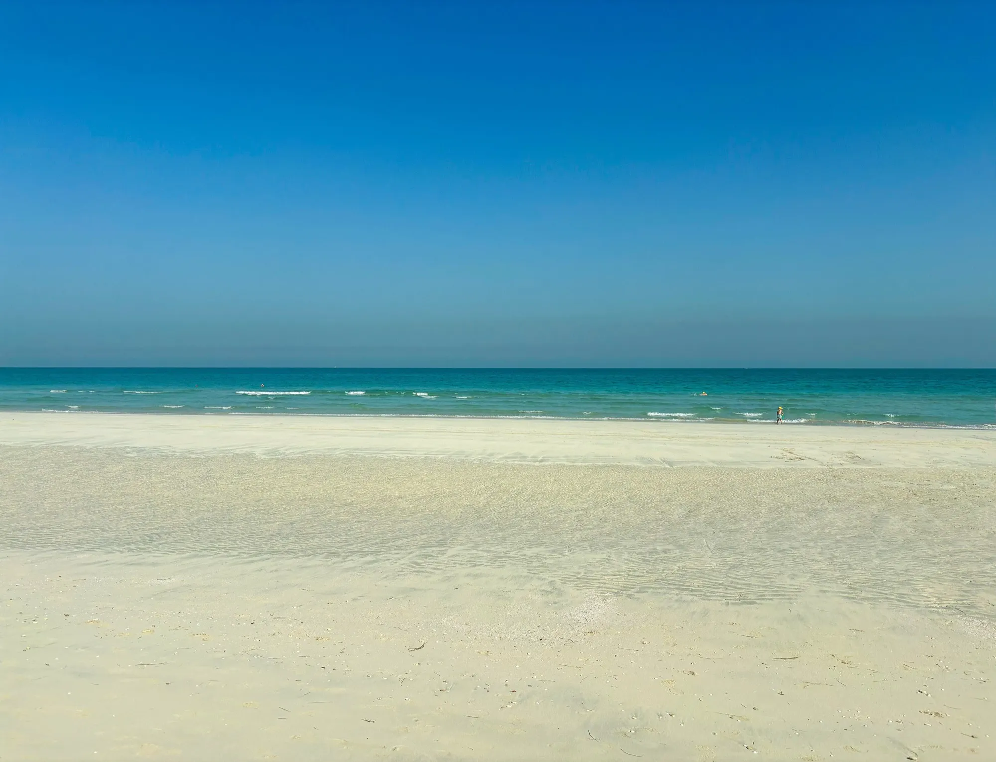 The pale sand and turquoise water of a Saadiyat Island beach in Abu Dhabi