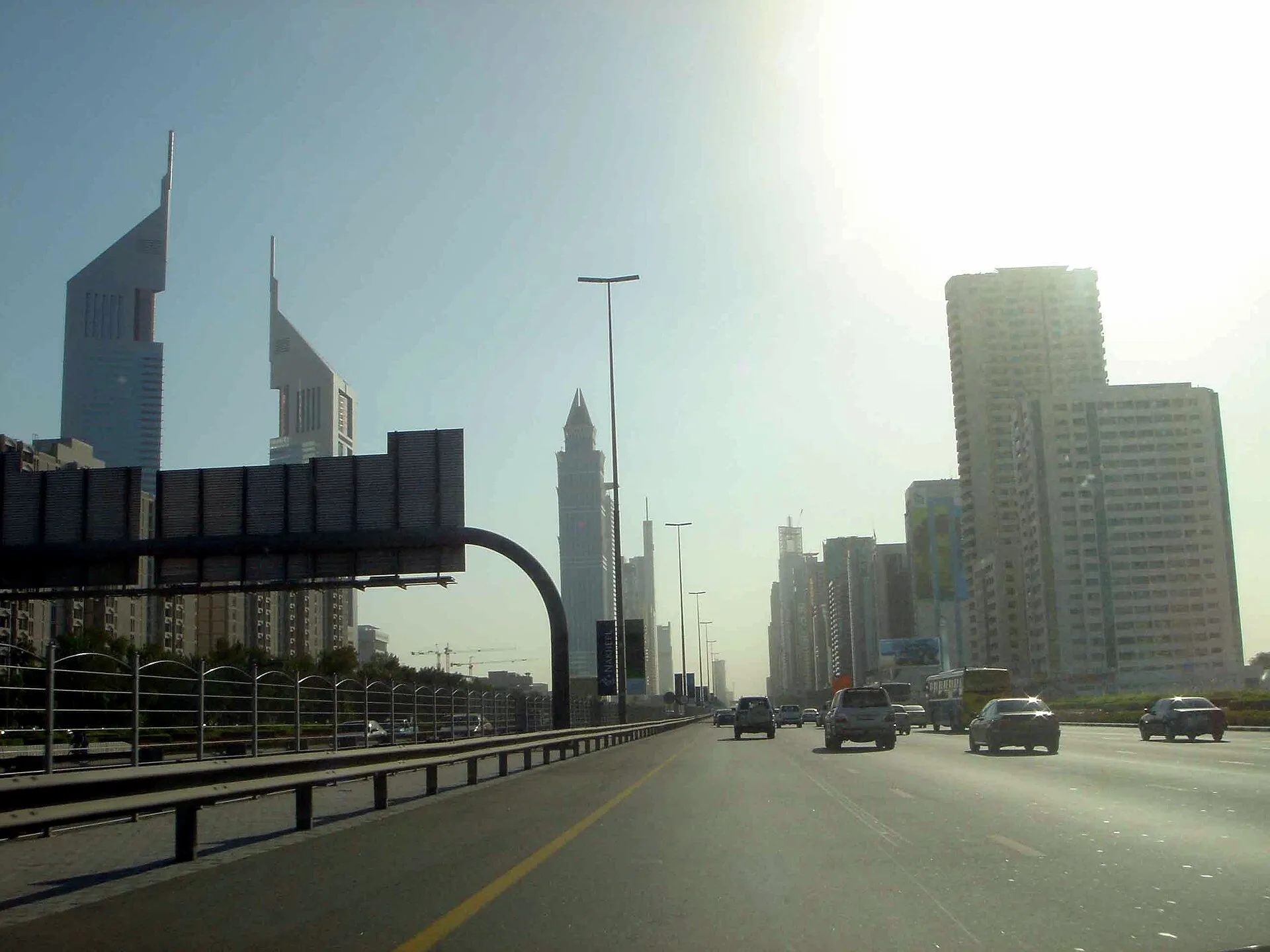 A view along Sheikh Zayed Road in Dubai with glass skyscrapers rising on either side