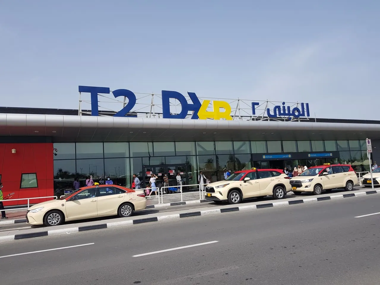 Dubai taxis outside the arrivals entrance of Terminal 2 at Dubai International Airport