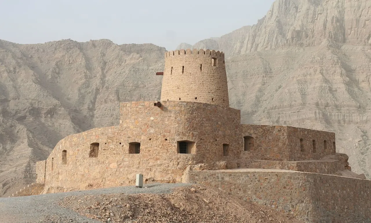 The stone fort at Tibat in Musandam, below bare limestone mountains