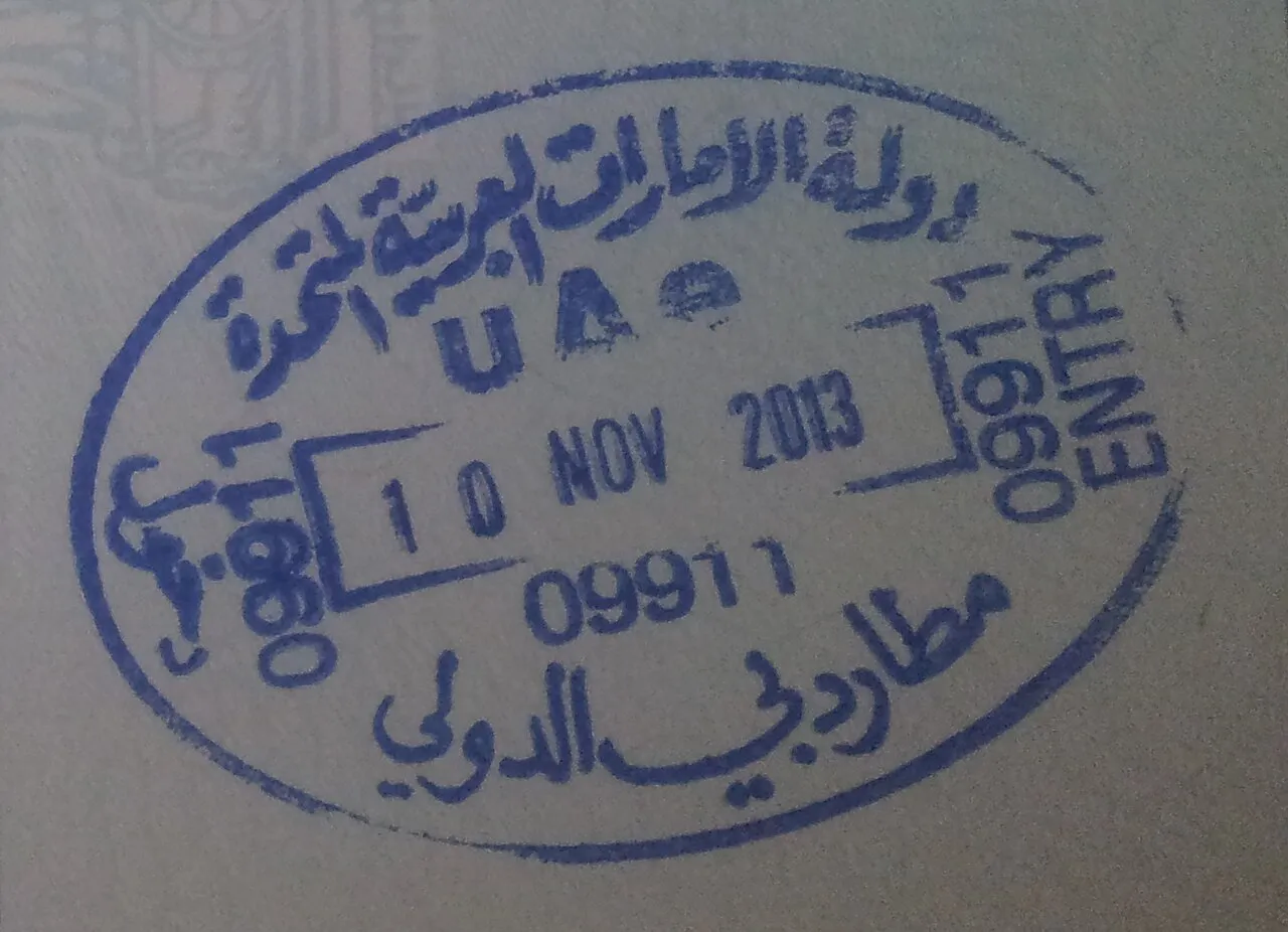 A UAE entry stamp from Dubai International Airport in a passport, dated 10 November 2013