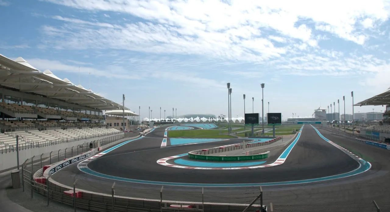 Covered grandstands beside a tight corner at Yas Marina Circuit, seen on a non-race day